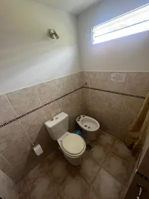 a bathroom with a toilet and a bidet at Depto para 4 personas con pileta a 3 cuadras del rio in Villa Carlos Paz