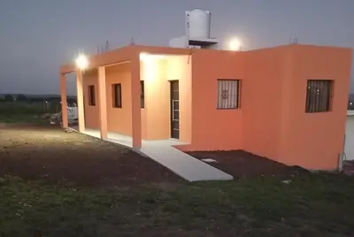 a small orange house with a light on top at Los Espinillos in Villa Yacanto