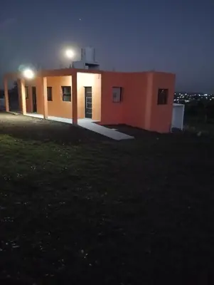 a small house with lights on top of it at night at Los Espinillos in Villa Yacanto