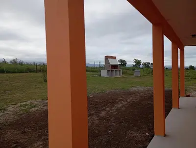 a view of a building in a field at Los Espinillos in Villa Yacanto