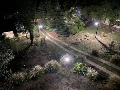 an overhead view of a park at night with lights at Altos del Oeste in Villa Carlos Paz