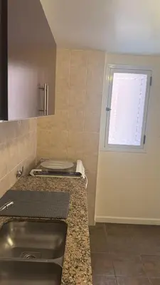 a kitchen with a sink and a window at San Lorenzo - Nueva Córdoba in Cordoba