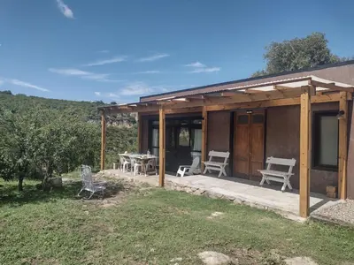 a house with a patio with a table and chairs at 