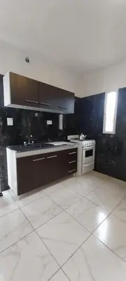 a kitchen with a sink and a stove in it at CASA - HAUS - Villa Cura Brochero in Villa Cura Brochero