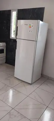a white refrigerator and freezer in a kitchen at CASA - HAUS - Villa Cura Brochero in Villa Cura Brochero