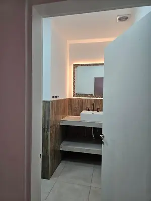a bathroom with a sink and a mirror at Casa Montana in Potrero de Garay