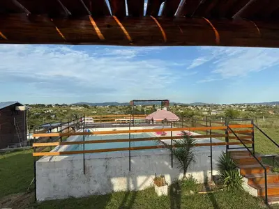 a view of a swimming pool from a building at Casa en Tanti con pileta in Tanti