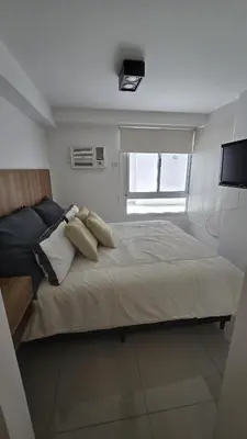 a bedroom with a large bed with two pillows at COFICO DPTO de CATEGORIA in Cordoba