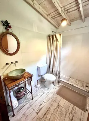 a bathroom with a sink and a toilet at La Donosita in La Carolina in La Carolina