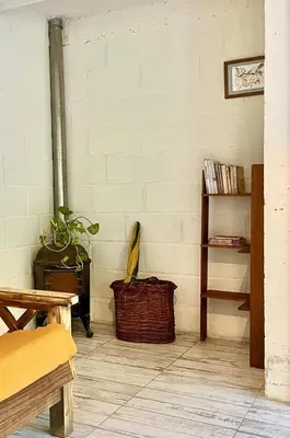 a room with a plant and a basket on the floor at La Donosita in La Carolina in La Carolina