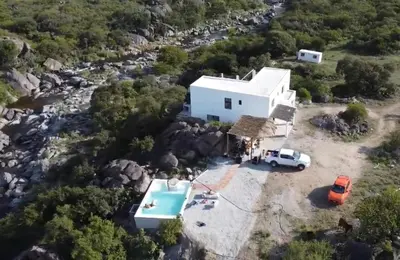 an aerial view of a white building with a pool at Finca Río Secreto in Taninga