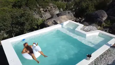 a woman and a girl laying in a pool of water at Finca Río Secreto in Taninga