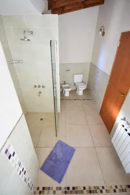 a bathroom with a shower and a toilet at Las Calandrias in Los Reartes