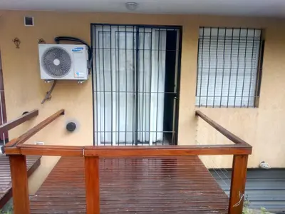 a building with a door with a speaker on it at Alojamiento Centro de Carlos Paz in Villa Carlos Paz