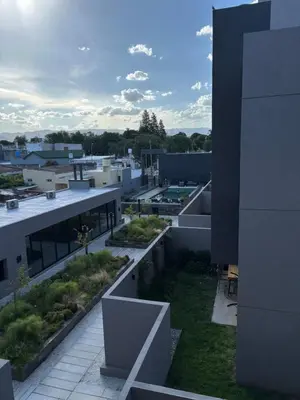 an aerial view of a building with plants on it at Las Pircas Housing in Alta Gracia