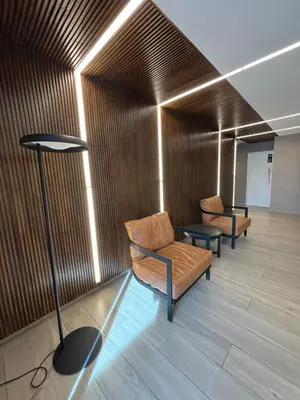 a waiting room with two chairs and a lamp at Las Pircas Housing in Alta Gracia
