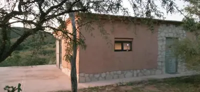 a brick building with a window on the side of it at Casas Serranas in La Bajada