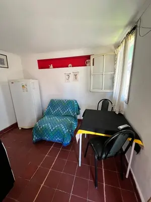 a small room with a table and a chair at Cabaña AGU en Cabañas María in Villa Carlos Paz