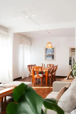 a living room with a table and chairs at Piso completo en el centro de cordoba, muy amplio especial para familias in Cordoba