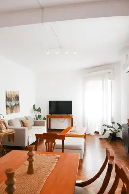 a living room with a couch and a table at Piso completo en el centro de cordoba, muy amplio especial para familias in Cordoba