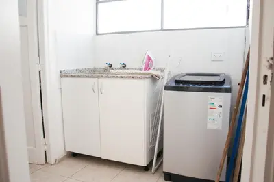 a kitchen with a sink and a small refrigerator at Piso completo en el centro de cordoba, muy amplio especial para familias in Cordoba