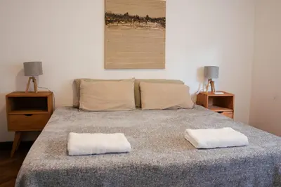 a bedroom with a bed with two pillows on it at Piso completo en el centro de cordoba, muy amplio especial para familias in Cordoba