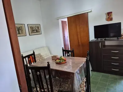 a dining room with a table with a bowl of fruit on it at Don EDELMI 2 in Cordoba