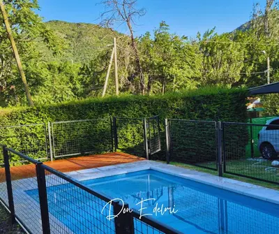 a swimming pool with a fence around it at Don EDELMI 2 in Cordoba