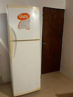 a white refrigerator with a sticker on the door at Monarcas II in Villa Carlos Paz