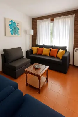 a living room with a couch and a coffee table at Hermosa Casa en el Centro, con Cochera in Villa Carlos Paz