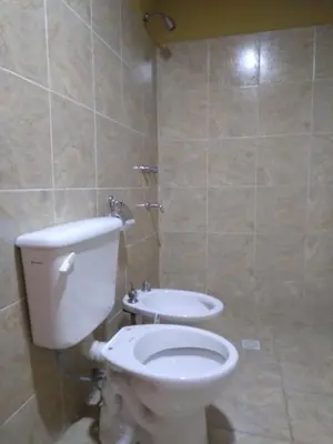 a bathroom with a toilet and a sink at Complejo Habitacional RLM 25 in Cortaderas