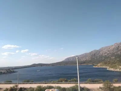 a view of a river with mountains in the background at Complejo Habitacional RLM 25 in Cortaderas