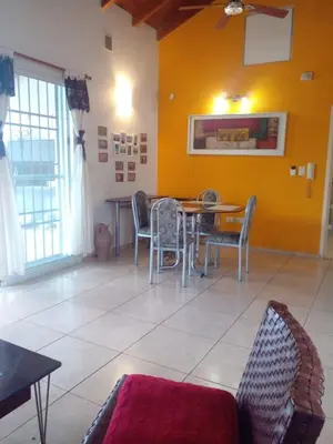 a dining room with a table and chairs at Casa en Lomas del Rey - Mayu Sumaj in San Antonio de Arredondo