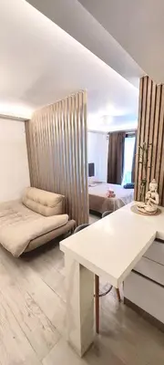 a living room with a couch and a table at departamento boutique centrico- villa carlos paz in Villa Carlos Paz