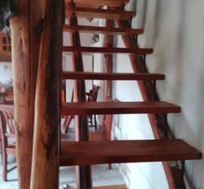 a group of wooden stairs in a room at cabaña rustica in Bialet Massé