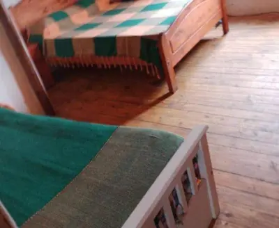 a living room with a couch and a table at cabaña rustica in Bialet Massé