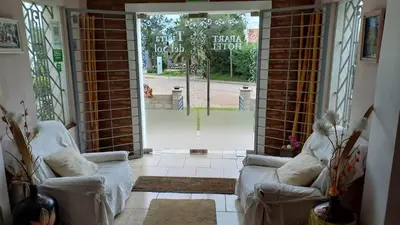 an open door with two couches in a room at Tierra del Sol in Merlo