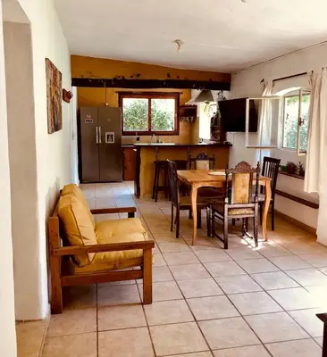 a kitchen and living room with a table and chairs at Algarrobo del Valle in San Javier