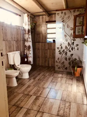 a bathroom with a toilet and a sink at Algarrobo del Valle in San Javier