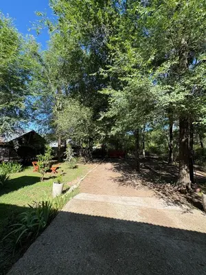 a dirt road in a yard with trees at Casa Milan in Villa General Belgrano