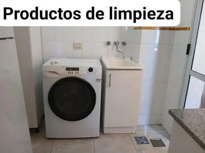 a washing machine in a bathroom with the words products de limica at Depto en Barrio General Paz in Cordoba
