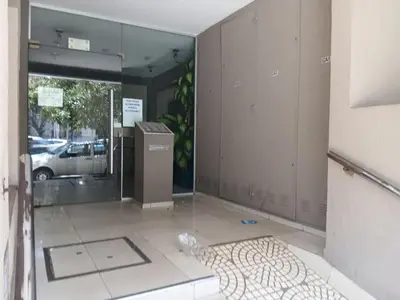 an empty room with a glass door in a building at Depto en Barrio General Paz in Cordoba