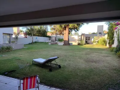 a view of a backyard with a picnic table in the grass at The House you're looking for in Cordoba