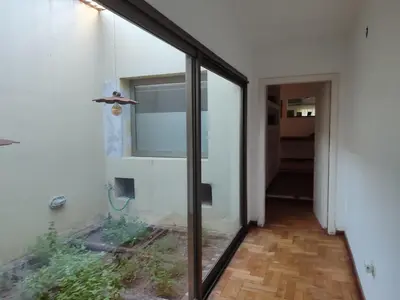 a glass door leading into a room with a window at The House you're looking for in Cordoba