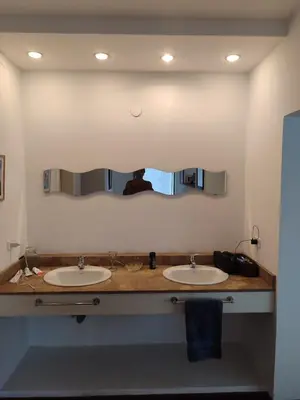 a bathroom with two sinks and a large mirror at The House you're looking for in Cordoba