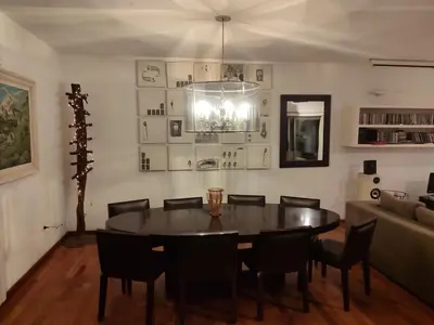 a dining room with a table and chairs and a couch at The House you're looking for in Cordoba