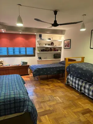 a living room with two beds and a ceiling at La mejor opción para tu estadía en Córdoba con amigos in Cordoba