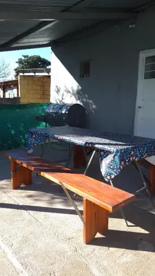 a picnic table with a surfboard on top of it at Departamento CR in Alta Gracia