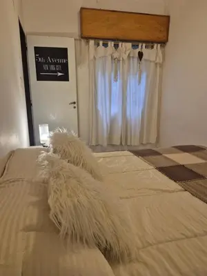 a bedroom with a bed with a tuft of hay at Apartamento en Villa Carlos Paz in Villa Carlos Paz