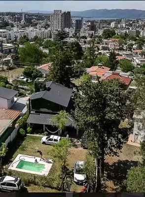 an aerial view of a house with a pool in a city at Mirian house in Villa Carlos Paz